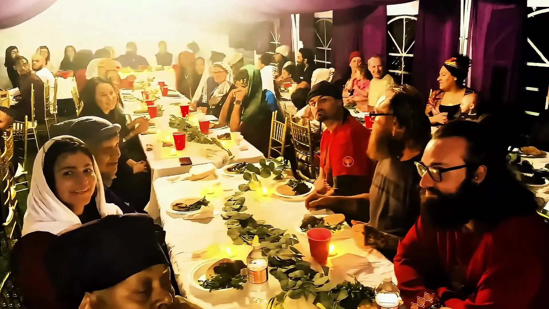 The mishfaha gathered around a long candlelit table for the feast.